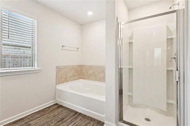 24359 Dawson Ct, Ponchatoula, LA 70454 - full bathroom with a shower stall, a garden tub, wood finished floors, and plenty of natural light