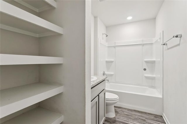 24359 Dawson Ct, Ponchatoula, LA 70454 - bathroom with wood finished floors, vanity, and  shower combination