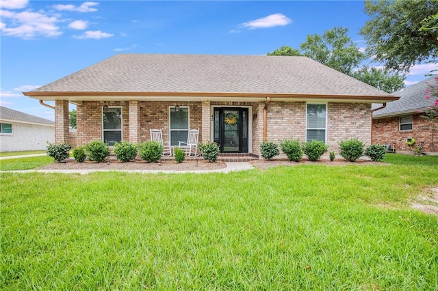 42 Melrose Dr, Destrehan, LA 70047 - ranch-style home featuring brick siding, a front lawn, and covered porch