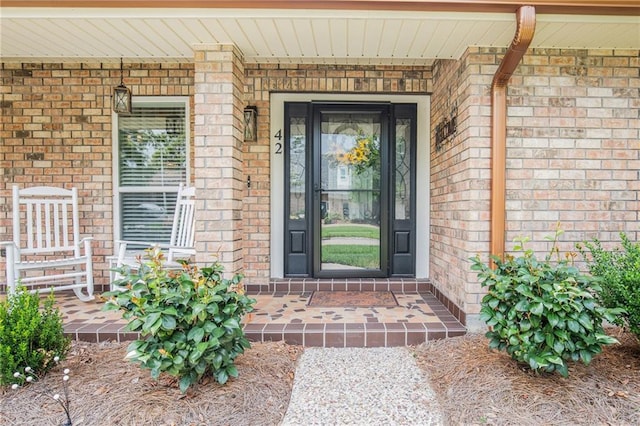 42 Melrose Dr, Destrehan, LA 70047 - entrance to property with brick siding and a porch