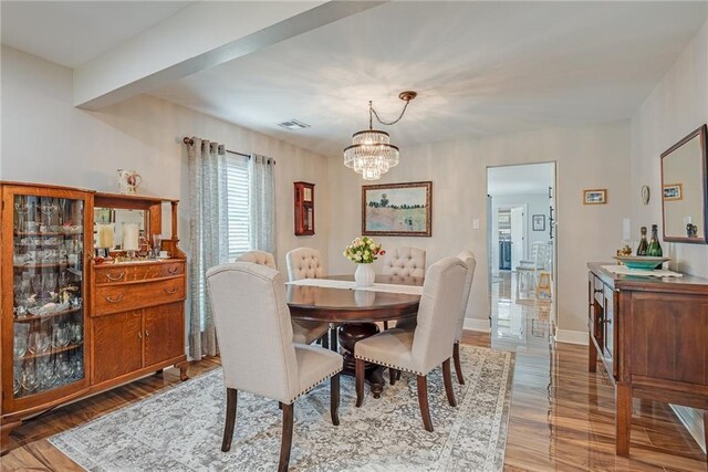42 Melrose Dr, Destrehan, LA 70047 - dining space featuring wood finished floors and a chandelier