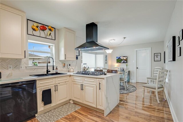 42 Melrose Dr, Destrehan, LA 70047 - kitchen featuring wall chimney exhaust hood, black dishwasher, stainless steel gas stovetop, and light wood finished floors