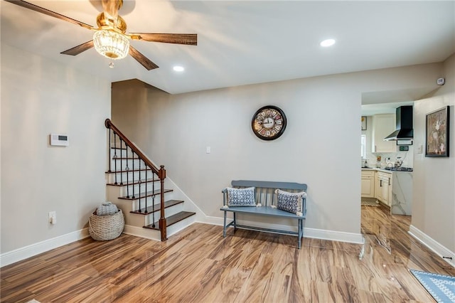 42 Melrose Dr, Destrehan, LA 70047 - living area with light wood-type flooring, ceiling fan, stairway, and recessed lighting