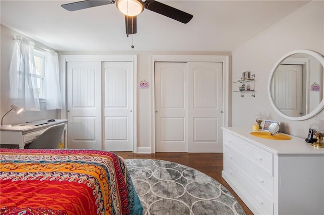 42 Melrose Dr, Destrehan, LA 70047 - bedroom with two closets, dark wood-style flooring, and ceiling fan