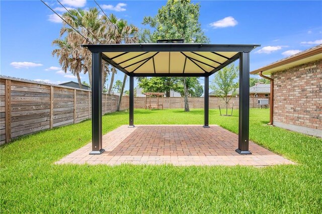 42 Melrose Dr, Destrehan, LA 70047 - fenced backyard with a gazebo and a patio