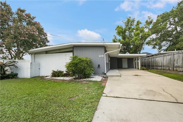 2812 Green Acres Rd, Metairie, LA 70003 - mid-century inspired home featuring a carport and driveway
