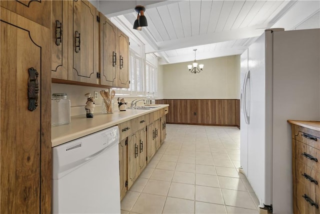 2812 Green Acres Rd, Metairie, LA 70003 - kitchen featuring white appliances, a chandelier, light countertops, wainscoting, and beam ceiling