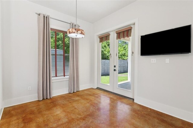 904 W 16th Ave, Covington, LA 70433 - unfurnished dining area with french doors and finished concrete flooring