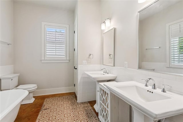 904 W 16th Ave, Covington, LA 70433 - bathroom with a freestanding tub and toilet