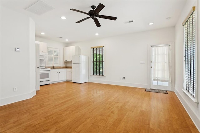 904 W 16th Ave, Covington, LA 70433 - unfurnished living room featuring light wood-style floors, ceiling fan, and recessed lighting