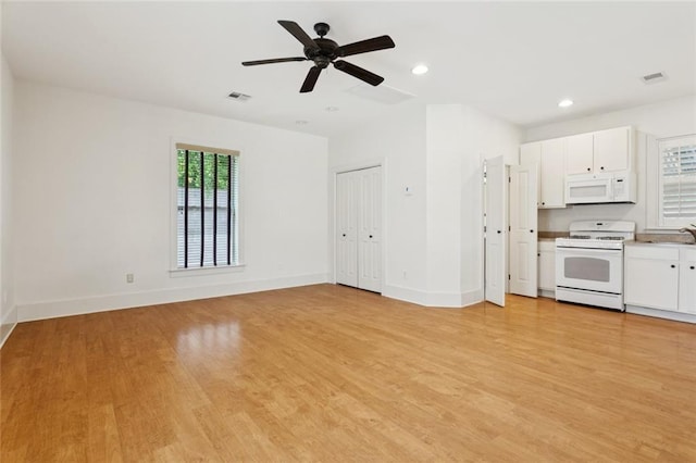 904 W 16th Ave, Covington, LA 70433 - unfurnished living room with light wood-style floors, a ceiling fan, and recessed lighting