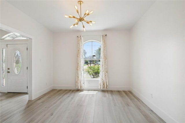 5910 Milne Blvd, New Orleans, LA 70124 - entrance foyer with a chandelier and light wood-style flooring