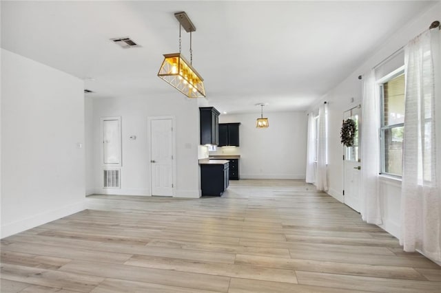 5910 Milne Blvd, New Orleans, LA 70124 - unfurnished living room featuring light wood-style floors