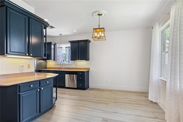 5910 Milne Blvd, New Orleans, LA 70124 - kitchen featuring stainless steel dishwasher, blue cabinets, light wood-type flooring, light countertops, and decorative light fixtures