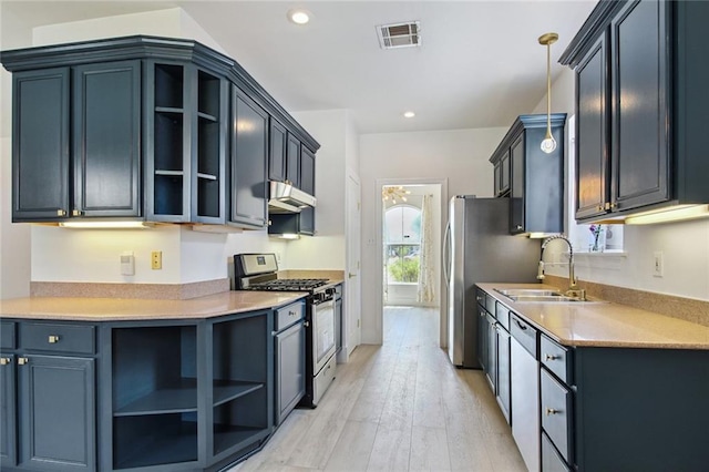 5910 Milne Blvd, New Orleans, LA 70124 - kitchen with gas range, open shelves, under cabinet range hood, light wood finished floors, and recessed lighting