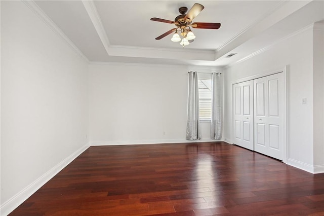 5910 Milne Blvd, New Orleans, LA 70124 - unfurnished bedroom featuring a raised ceiling, wood finished floors, a closet, ornamental molding, and ceiling fan