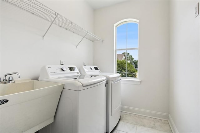 5910 Milne Blvd, New Orleans, LA 70124 - laundry room with washing machine and clothes dryer and baseboards