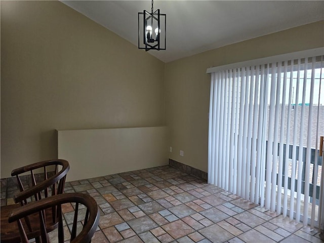 4829 Wabash St Unit 307, Metairie, LA 70001 - unfurnished dining area with a chandelier, lofted ceiling, and stone finish flooring