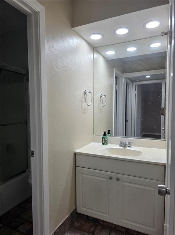 4829 Wabash St Unit 307, Metairie, LA 70001 - bathroom featuring vanity, stone finish flooring, and recessed lighting