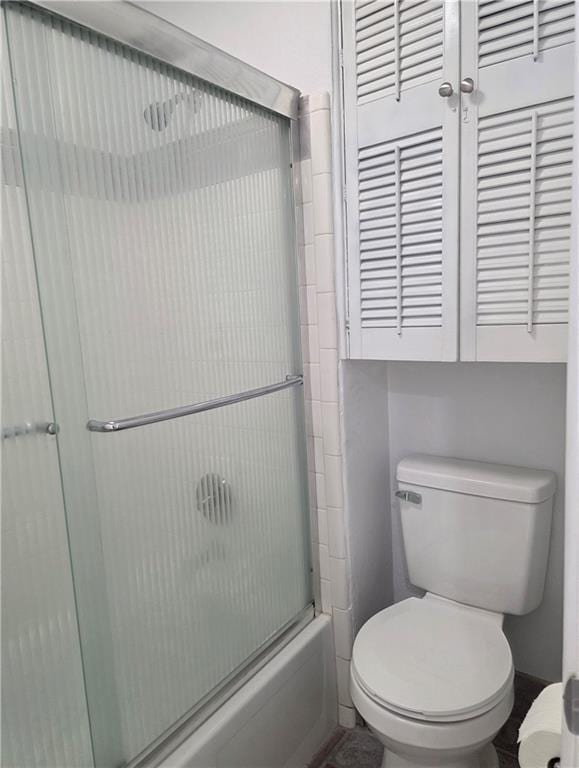 4829 Wabash St Unit 307, Metairie, LA 70001 - bathroom with toilet and bath / shower combo with glass door