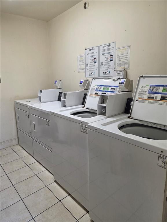 4829 Wabash St Unit 307, Metairie, LA 70001 - community laundry with light tile patterned floors and washing machine and dryer