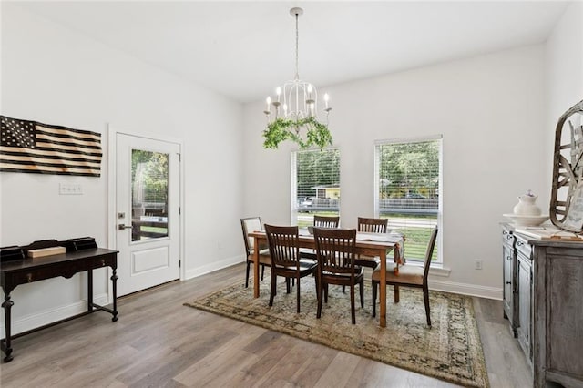 19480 N 3rd St, Covington, LA 70433 - dining room featuring a chandelier and light wood-style flooring