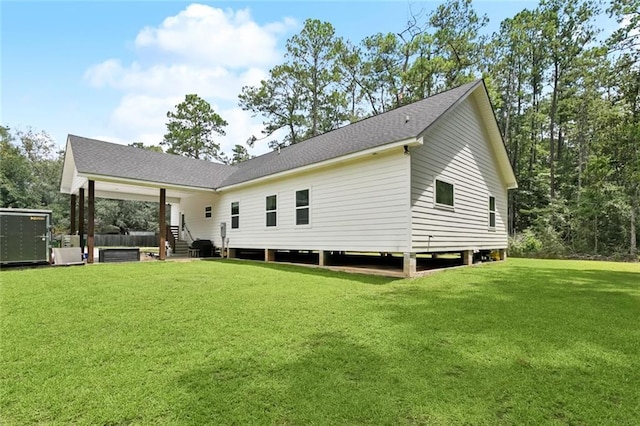19480 N 3rd St, Covington, LA 70433 - rear view of property featuring a yard and roof with shingles