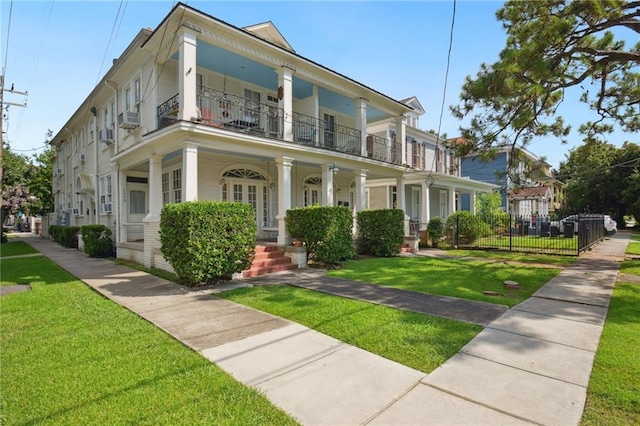 113335 Fern St, New Orleans, LA 70118 - greek revival house featuring a balcony, covered porch, and cooling unit