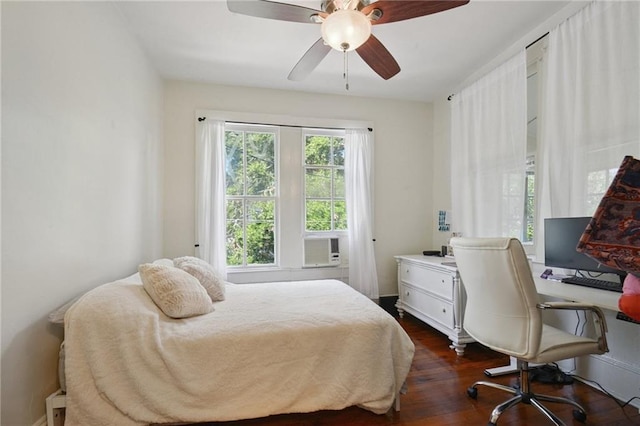 113335 Fern St, New Orleans, LA 70118 - bedroom featuring dark wood-style flooring, cooling unit, a ceiling fan, and an office area