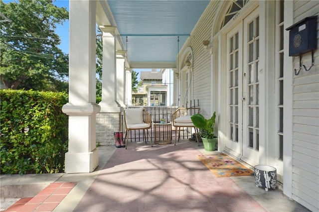 113335 Fern St, New Orleans, LA 70118 - covered porch featuring french doors