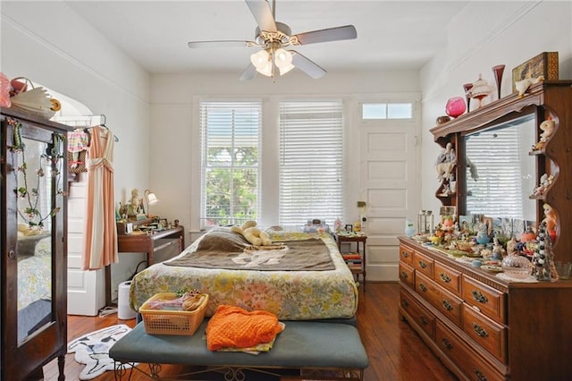 113335 Fern St, New Orleans, LA 70118 - bedroom featuring multiple windows, dark wood-type flooring, and a ceiling fan