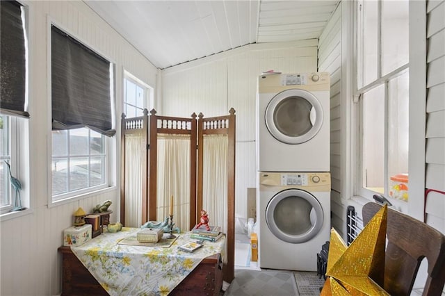 113335 Fern St, New Orleans, LA 70118 - washroom with stacked washer / drying machine and wooden walls
