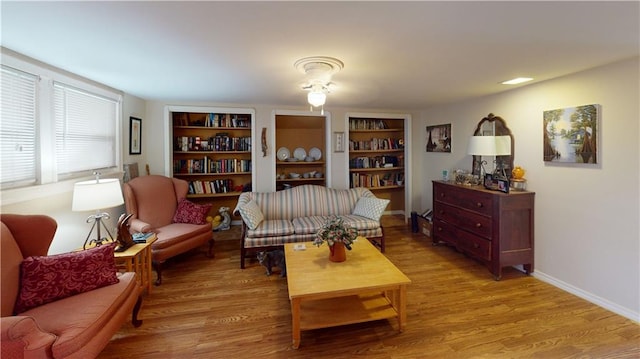 3229 Hero Dr, Gretna, LA 70053 - living area featuring light wood finished floors and built in shelves