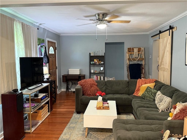 517 Colony Pl, Metairie, LA 70003 - living area featuring wood finished floors, ceiling fan, a barn door, and crown molding