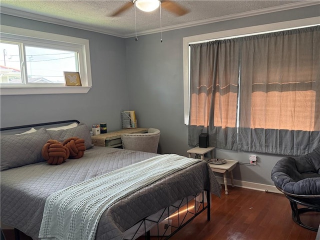 517 Colony Pl, Metairie, LA 70003 - bedroom featuring hardwood / wood-style floors, ornamental molding, a textured ceiling, and a ceiling fan