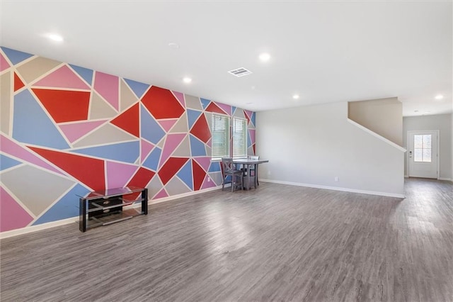 7542 1ST Lake Dr, Slidell, LA 70461 - playroom featuring an accent wall, recessed lighting, and wood finished floors
