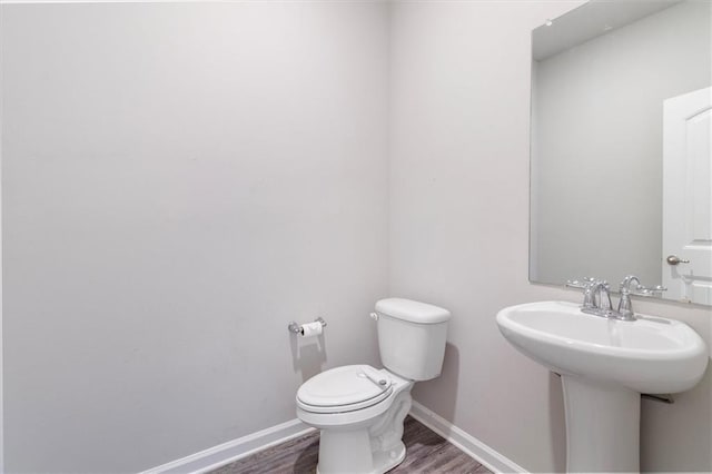 7542 1ST Lake Dr, Slidell, LA 70461 - bathroom with toilet and wood finished floors