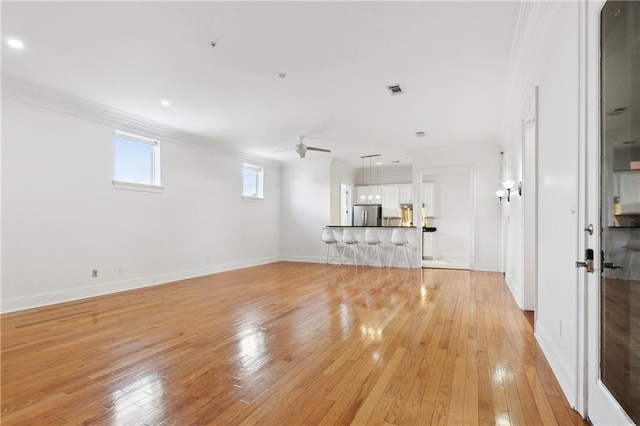 8416 Oak St Unit K, New Orleans, LA 70118 - unfurnished living room featuring ornamental molding, light wood-style floors, a ceiling fan, and recessed lighting