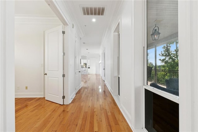 8416 Oak St Unit K, New Orleans, LA 70118 - hall with light wood finished floors, ornamental molding, and recessed lighting