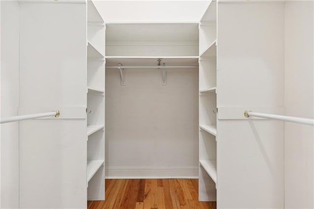 8416 Oak St Unit K, New Orleans, LA 70118 - walk in closet featuring wood finished floors
