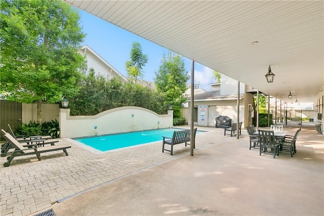 8416 Oak St Unit K, New Orleans, LA 70118 - view of swimming pool with a patio