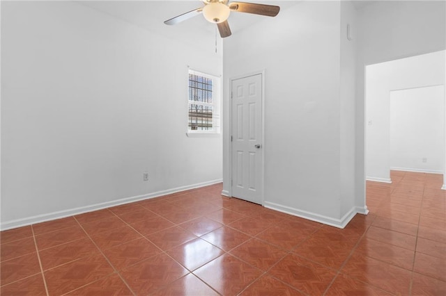 2446 N Rocheblave St, New Orleans, LA 70117 - spare room featuring a ceiling fan, tile patterned floors, and a high ceiling