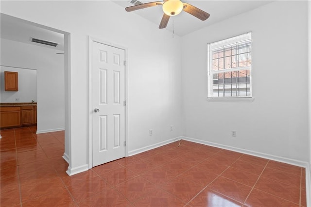 2446 N Rocheblave St, New Orleans, LA 70117 - unfurnished bedroom featuring tile patterned floors and a ceiling fan