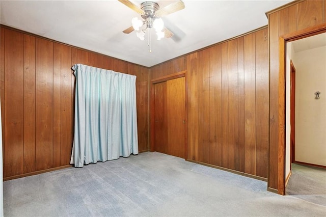 508 Arnold Ave, River Ridge, LA 70123 - unfurnished room featuring carpet floors, a ceiling fan, and wood walls