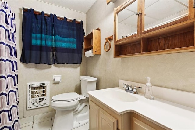 508 Arnold Ave, River Ridge, LA 70123 - bathroom with heating unit, tile patterned flooring, and vanity