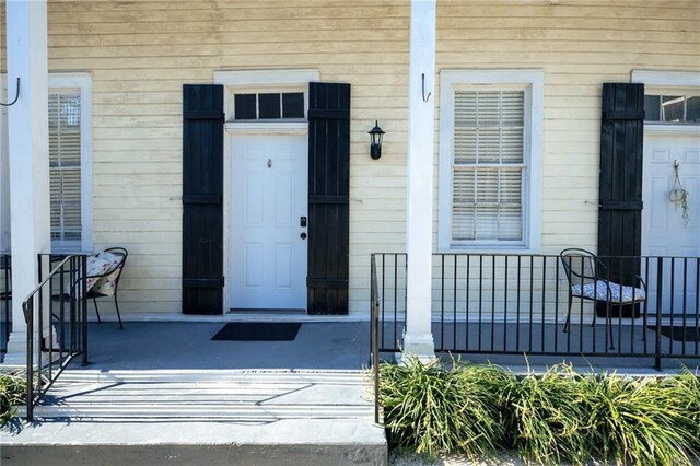 152729 Dumaine St, New Orleans, LA 70116 - doorway to property featuring covered porch