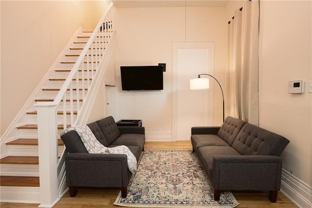 152729 Dumaine St, New Orleans, LA 70116 - living area with wood finished floors and stairs