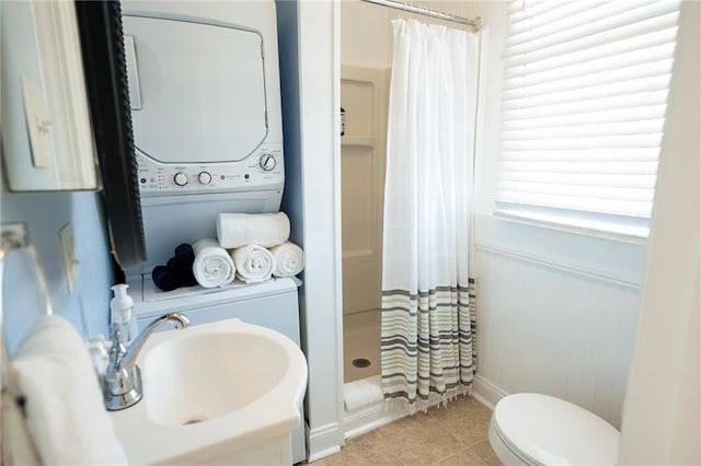 152729 Dumaine St, New Orleans, LA 70116 - bathroom with stacked washer / dryer, a stall shower, and tile patterned flooring