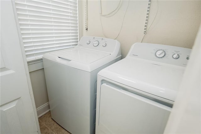 152729 Dumaine St, New Orleans, LA 70116 - washroom with washer and clothes dryer and tile patterned flooring