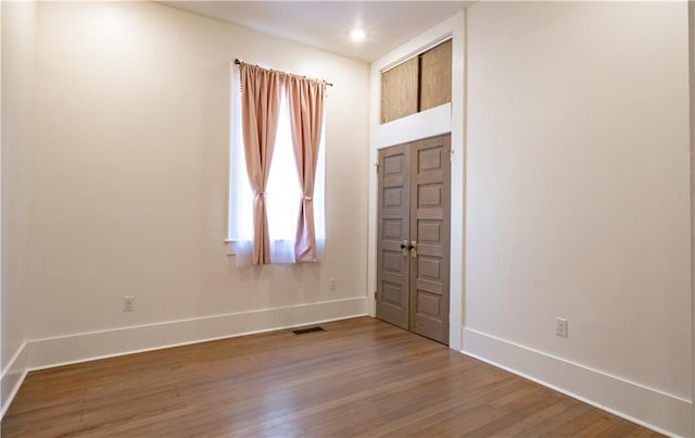 623-25 Louisa St, New Orleans, LA 70117 - empty room with wood finished floors